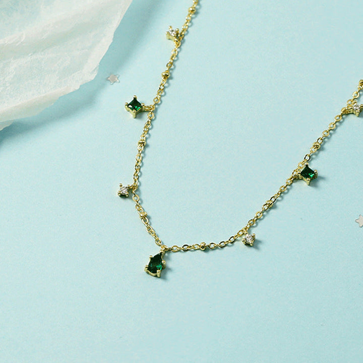Gold Charm Necklace Eithne with Emeralds