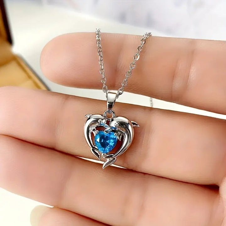 Silver Necklace Ailbhe with Dolphins and Sapphire Heart