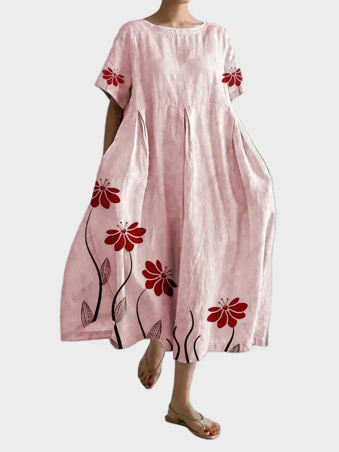 Rosa Kleid mit roten Blütenranken
