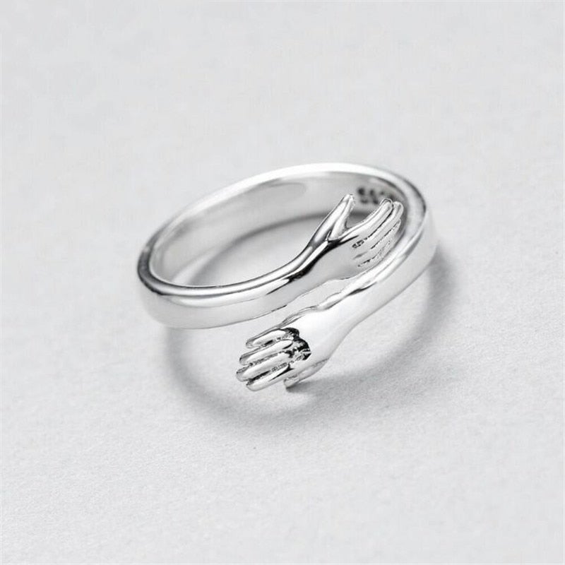 Sterling Silver Ring with Embracing Hands Motif