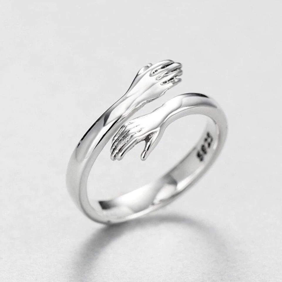 Sterling Silver Ring with Embracing Hands Motif
