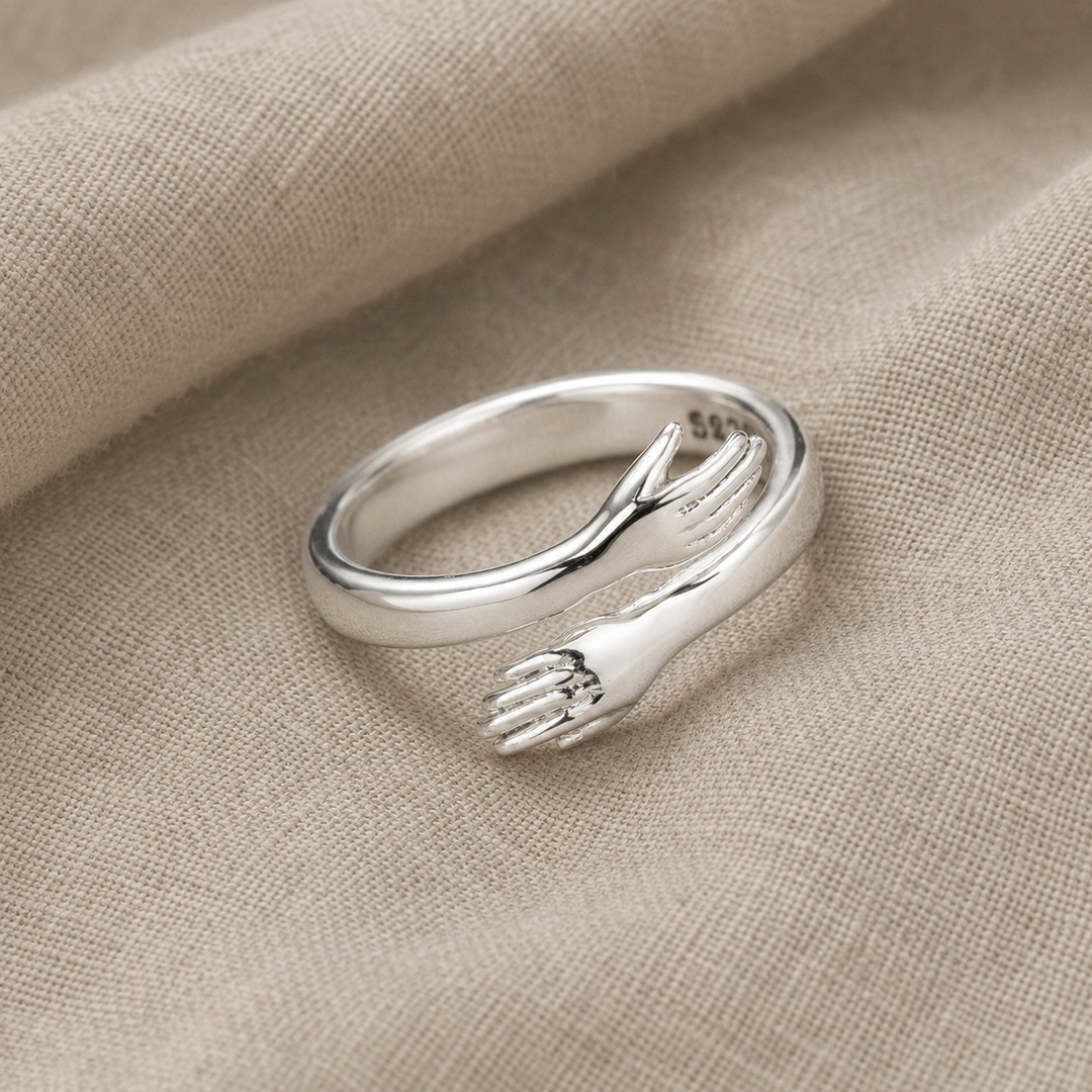 Sterling Silver Ring with Embracing Hands Motif