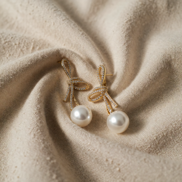 Gold Drop Earrings Cara with Zirconia Bow and Pearl
