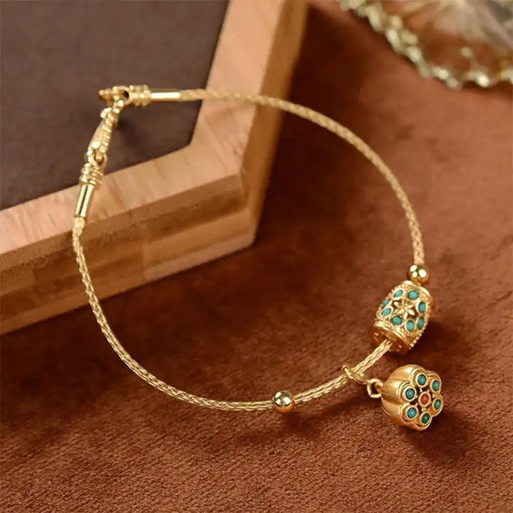 Gold Bangle Treasa with Turquoise Flower Charms