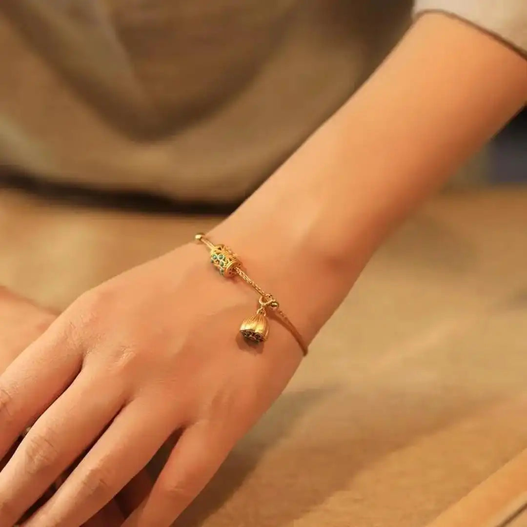 Gold Bangle Treasa with Turquoise Flower Charms