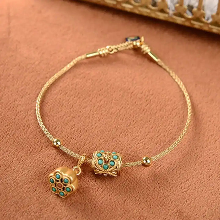 Gold Bangle Treasa with Turquoise Flower Charms