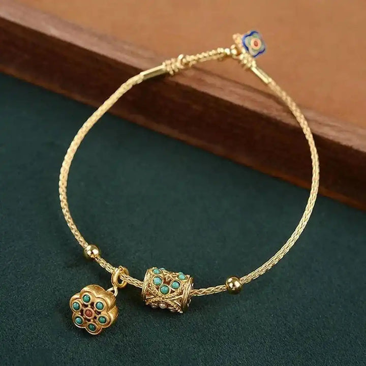 Gold Bangle Treasa with Turquoise Flower Charms