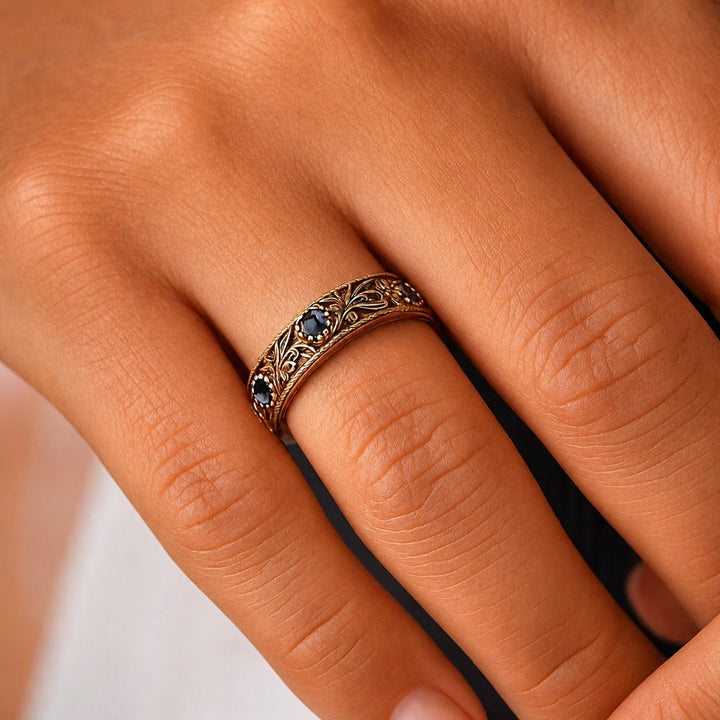 Gold Eternity Ring with Blue Sapphire and Floral Motif
