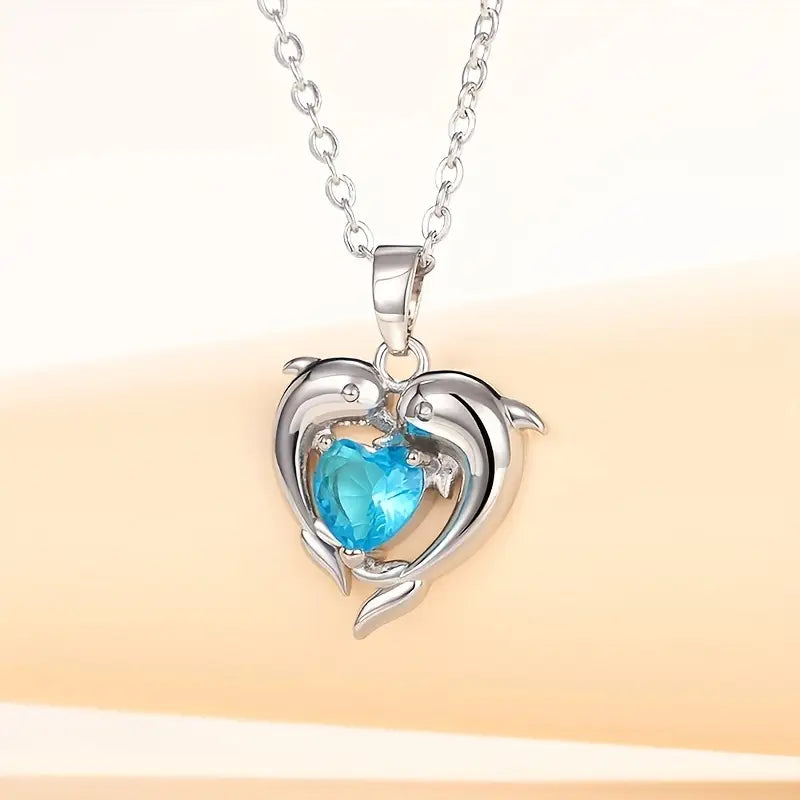 Silver Necklace Ailbhe with Dolphins and Sapphire Heart