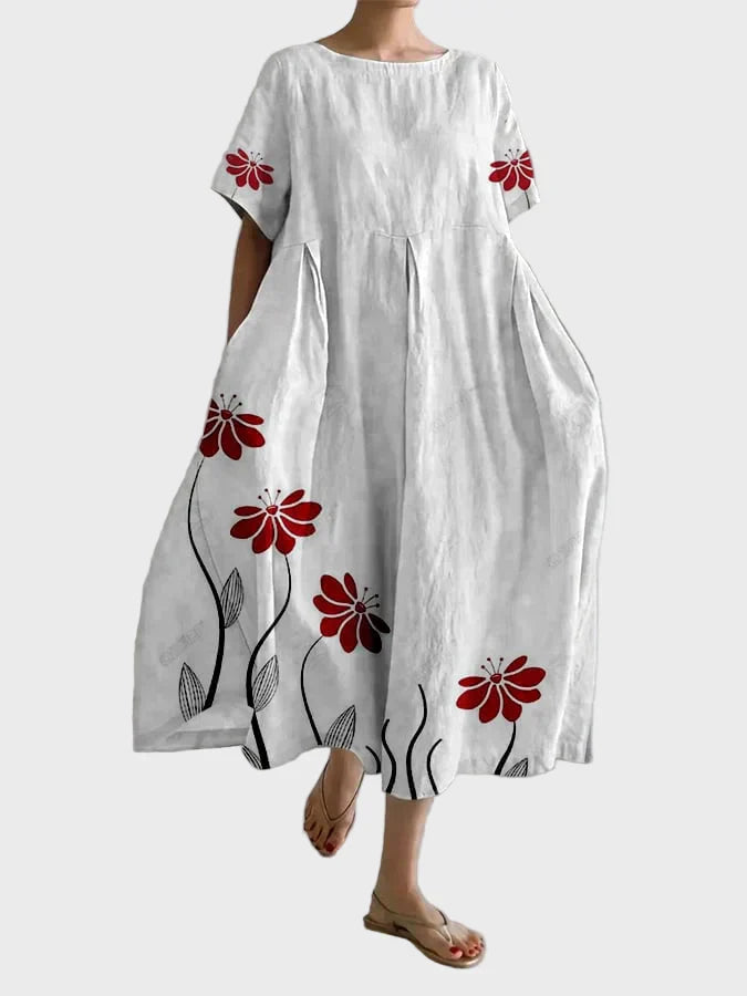 Rosa Kleid mit roten Blütenranken
