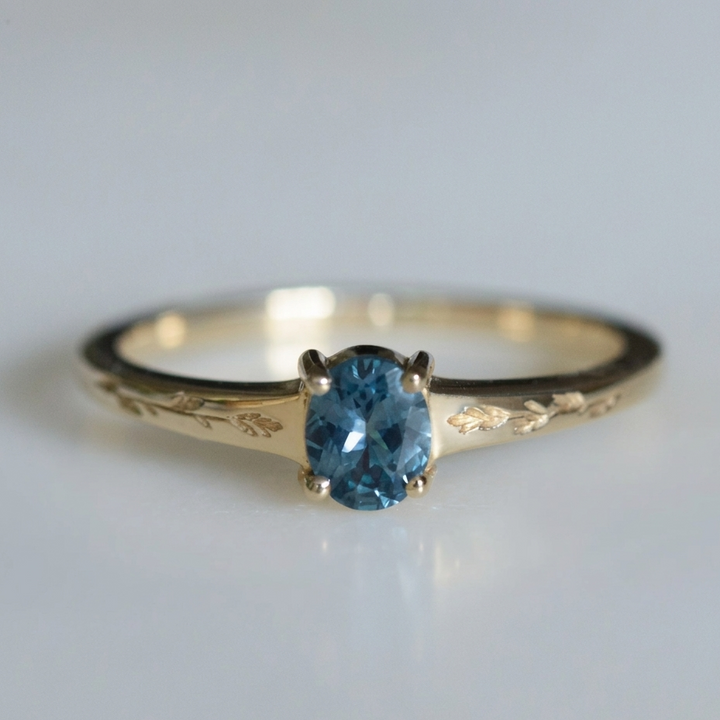 Gold Ring Sorcha with Blue Topaz & Leaf Motif